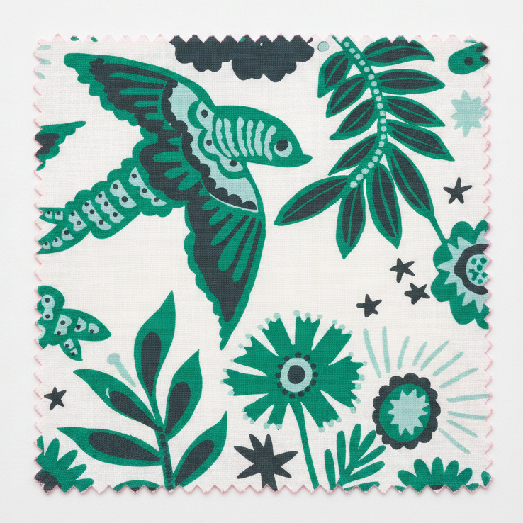 A hand‑drawn Holland Street “Park Life” pattern printed on linen and wallpaper, featuring birds, boats, and flowers in dark grey, white and green tones, designed in Britain.