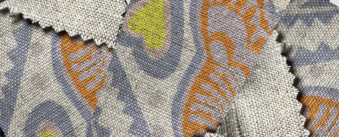 close up swatches of the woven patterns on linen fabrics with print
