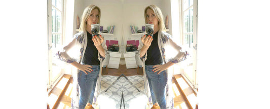 Lady in photo taking a selfie wearing Holland Street robe