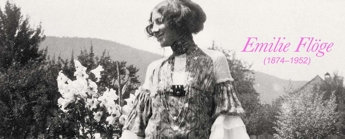 A black and white image of Emilie Floge a designer. the image has pink text with her name and birth and death year 1874- 1952