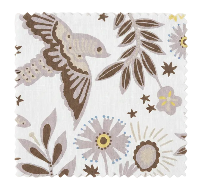 A hand‑drawn Holland Street “Park Life” pattern printed on linen and wallpaper, featuring birds, boats, and flowers in grey, brown and pale yellow tones, designed in Britain.