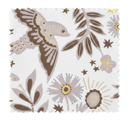 A hand‑drawn Holland Street “Park Life” pattern printed on linen and wallpaper, featuring birds, boats, and flowers in grey, brown and pale yellow tones, designed in Britain.