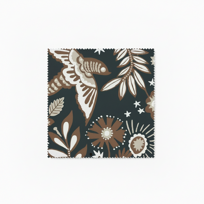 A hand‑drawn Holland Street “Park Life” pattern printed on linen and wallpaper, featuring birds, boats, and flowers in black, brown, white and cream tones, designed in Britain.