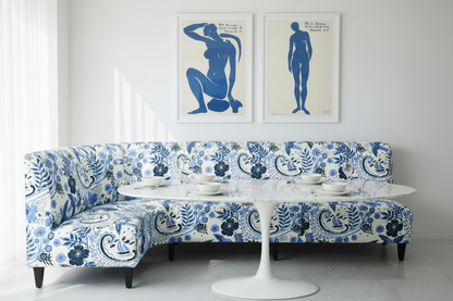 An upholstered modern sofa in the hand‑drawn Holland Street “Park Life”  linen, featuring birds, boats, and flowers in fresh blue, navy, and grey tones, designed in Britain.